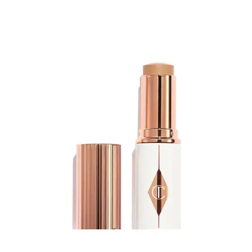 [5056446624978] Charlotte Tilbury Unreal Skin Sheer Glow Tint Foundation Stick - 6 Medium
